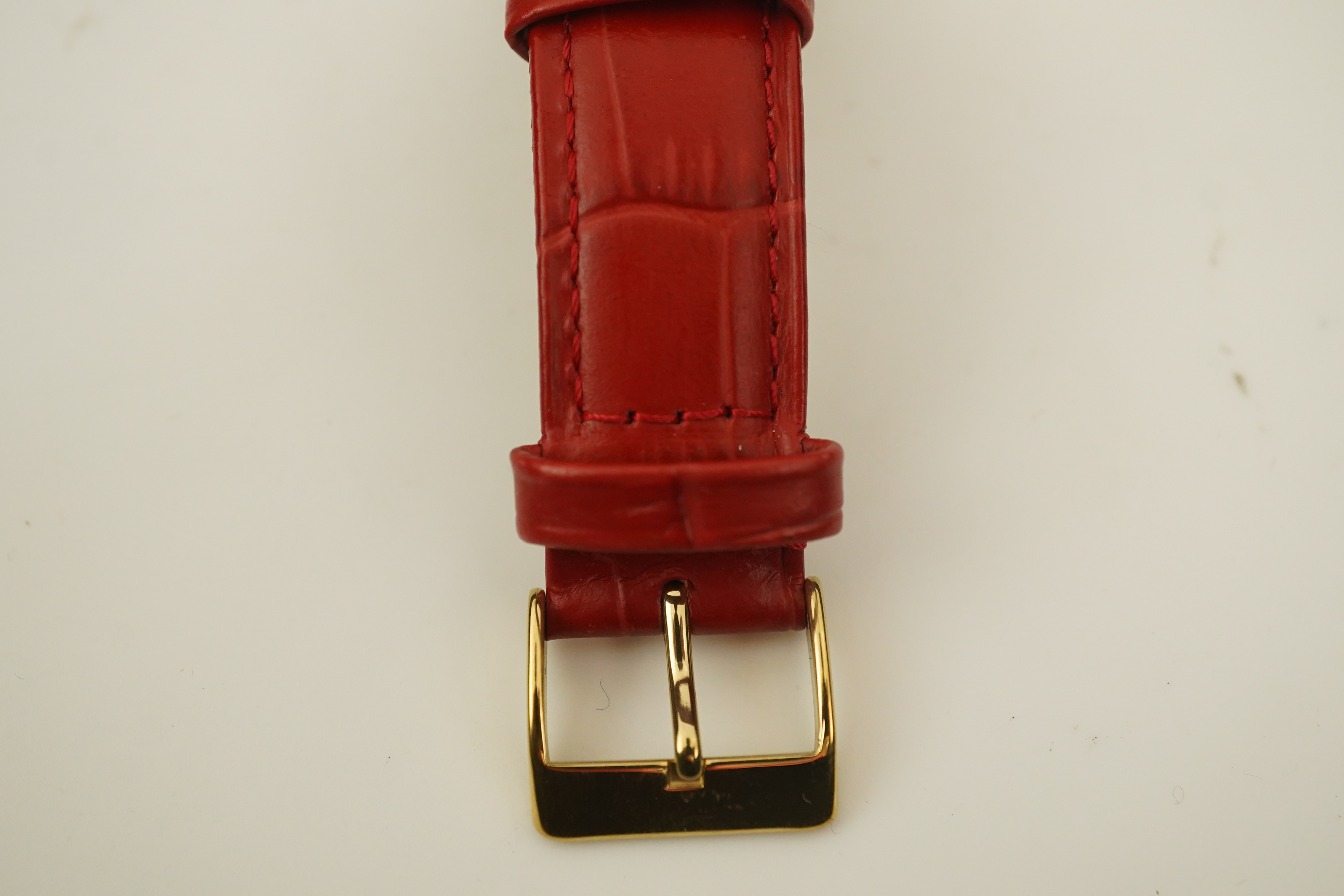 A gentleman's 1950's 18ct gold Jaeger LeCoultre manual wind wrist watch, on a later associated leather strap